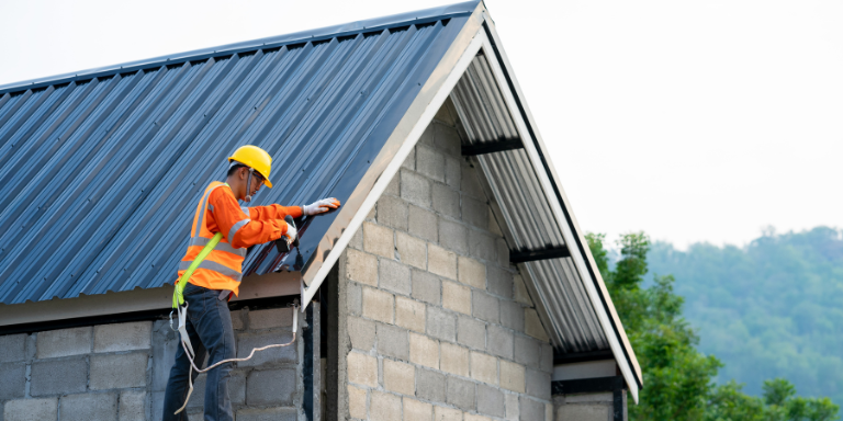 Man repairing the roof of a house